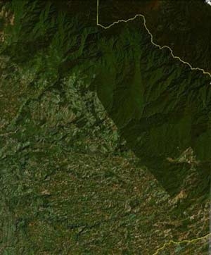 This is a satellite that shows southern Costa Rica near the border with Panama (yellow). Patterns of land use change at the border of a national park. Forests above and to the right of the park border store more carbon in plants and soils than farmlands to the left. You can find the location: 34°29'24.33N, 91°11'27.18W.