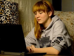 A girl using her laptop